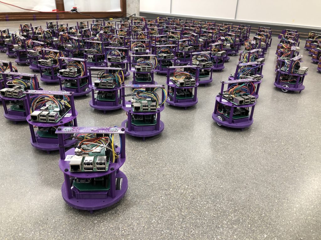 One hundred small robots line up in the laboratory.
Credit: Northwestern University